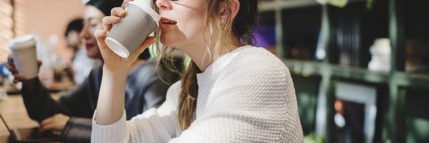 Blond woman having a cup of coffee