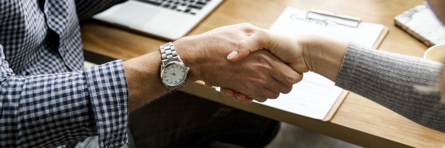 Business people shaking hands in agreement
